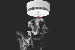 What is the difference between a smoke detector and a smoke alarm?